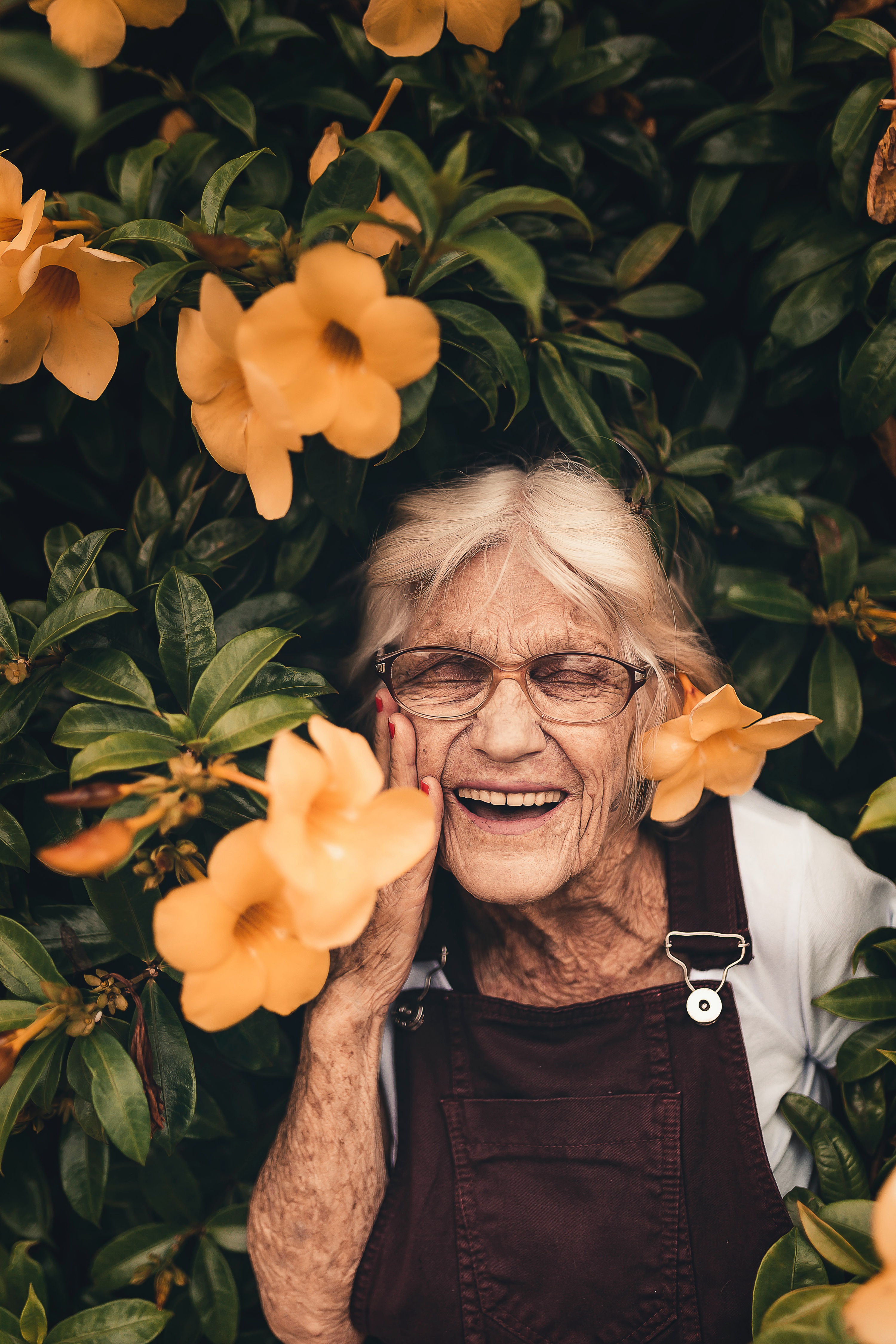 woman in front of flowers